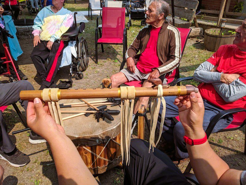 Matthew Assiniwe's flute, with elder drum circle